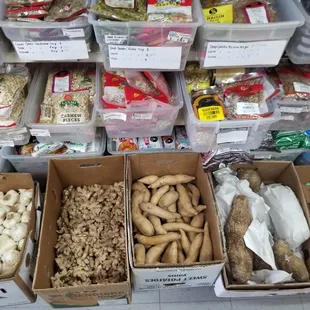 Fresh vegetables include garlic, ginger, and sweet potatoes