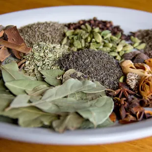 a bowl of spices and herbs