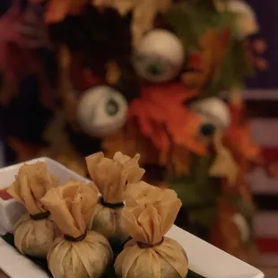 three dumplings on a plate