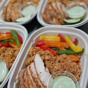Asado chicken with spanish quinoa, bell peppers and a cilantro lime crema sauce. Healthy meal prep, ready to eat when you are!