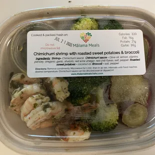 shrimp and broccoli in a container