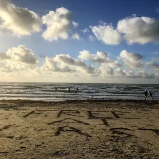 Someone created this using seaweed on the beach