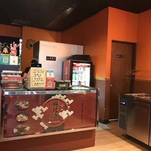 a kitchen with a refrigerator and a refrigerator freezer