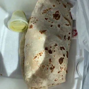 a tortilla in a styrofoam container