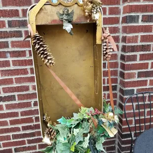 A phone booth turned altar outside of Malena&apos;s Taco Shop.