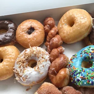 Chocolate frosted, filled chocolate bar, chocolate filled donut, cinnamon sugar twist, toasted coconut, plain glazed