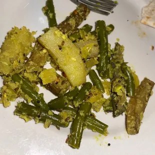 a plate of green beans and potatoes