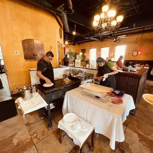 a man preparing food in a restaurant