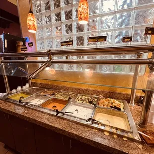 a buffet with a variety of food items