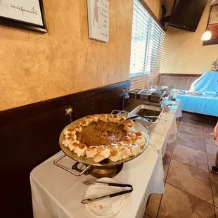 a pie on a buffet table