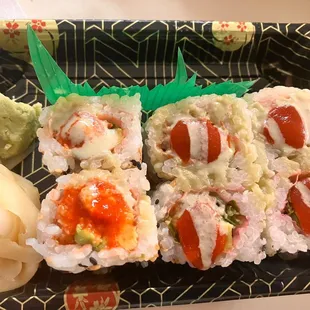 a plate of sushi with a pineapple on top