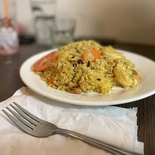 a plate of rice and vegetables