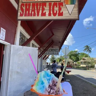 "The Rainbow" consists of strawberry, vanilla, banana flavored shave ice with condensed millk and icecream at the bottom.