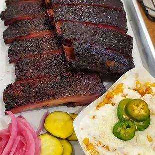Rack of ribs with Mexican street corn
