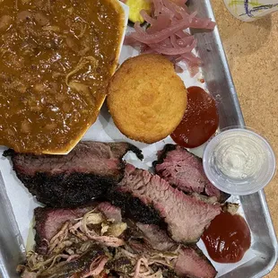 Yummy BBQ- Brisket, Pulled Pork, cornbread, baked beans, with homemade pickles and onions