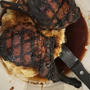 Charred black forged in fire pork chops.