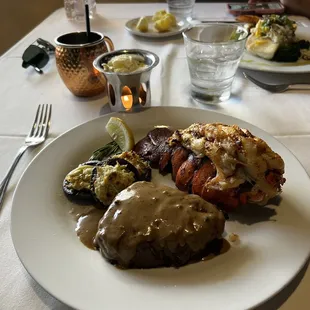 Surf and turf.  8 oz filet with lobster tail &amp; artichoke stuffed mushrooms.