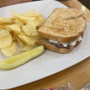 a sandwich and chips on a plate