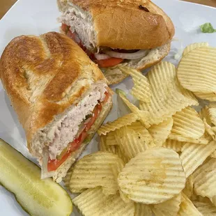 a sandwich and chips on a plate