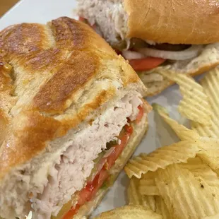 a sandwich and chips on a plate