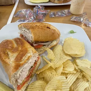 a sandwich and chips on a plate