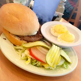 Hamburger (not to be confused with the larger deli burger) with deviled eggs.