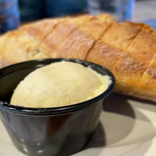 a bowl of ice cream and a loaf of bread