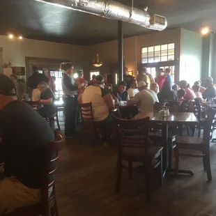 a large group of people sitting at tables