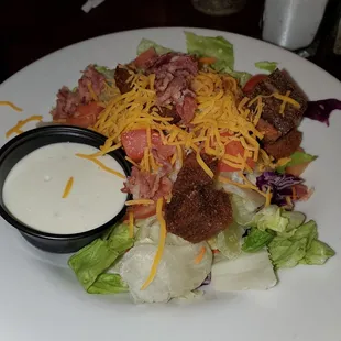 Side salad with bacon that comes standard. Blue cheese dressing