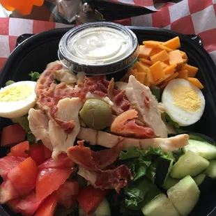 a salad in a plastic container