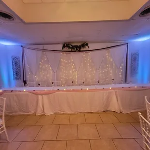 Our curtain wall is a beautiful backdrop for the Wedding Party head table inside the banquet room.