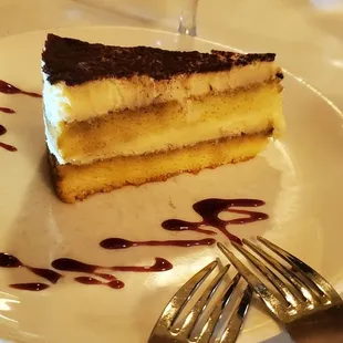 a piece of cake on a plate with a fork