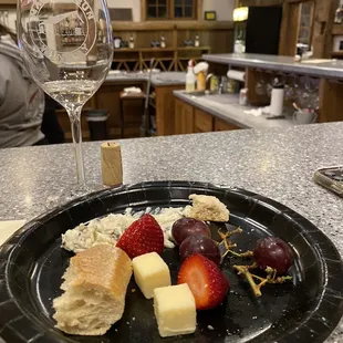 a plate of fruit and cheese