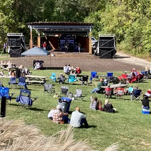 The lawn area in front of the stage.