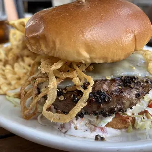 a burger with onion rings