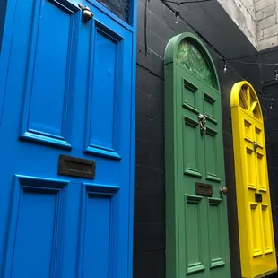 a row of brightly colored doors