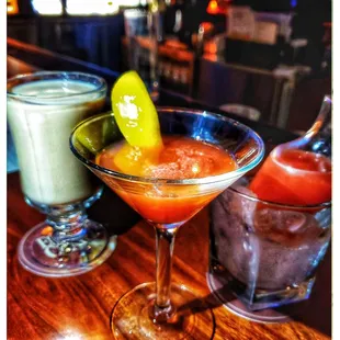 two cocktails on a bar