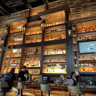 A bar with a ladder. Good thing it is behind the bar.