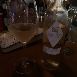 a glass of wine and a bottle of wine