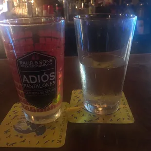 a glass of water and a drink