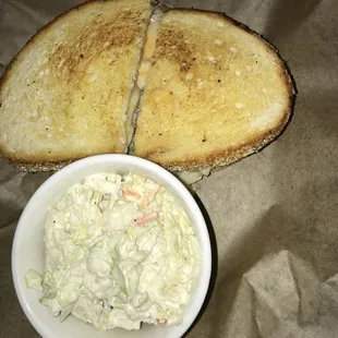 a grilled cheese sandwich and coleslaw