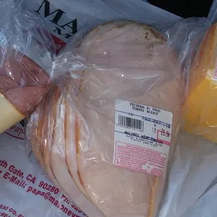 Turkey breast slices, muenster cheese and the sample.
