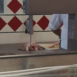 Fresh free range chicken being cut