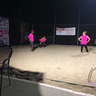 a group of people playing a game of softball