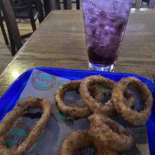 Onion rings with a vodka-blueberry energy drink.