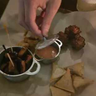 Sampler platter: thon et porc samussas, cod fritters, BBQ chicken. So dank