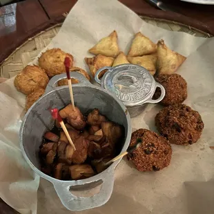 Appetizer sampler (assiette créole), with cheese samoussas, bonbon piment, boulette morue, and sarcives