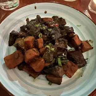 Champignons bourguignon créole (braised portobellos and carrots in a spiced red wine sauce)