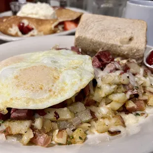 Two Egg Plate with house toast and Corned beef hash skillet.