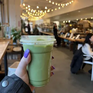 Matcha iced latte with oat milk and lavender added